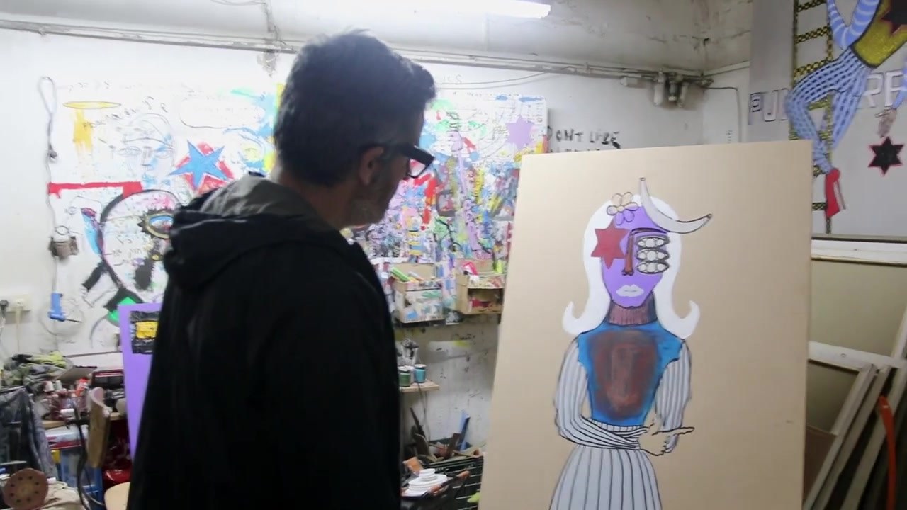 Bazooka Joe in the studio, facing a new canvas of a standing figure