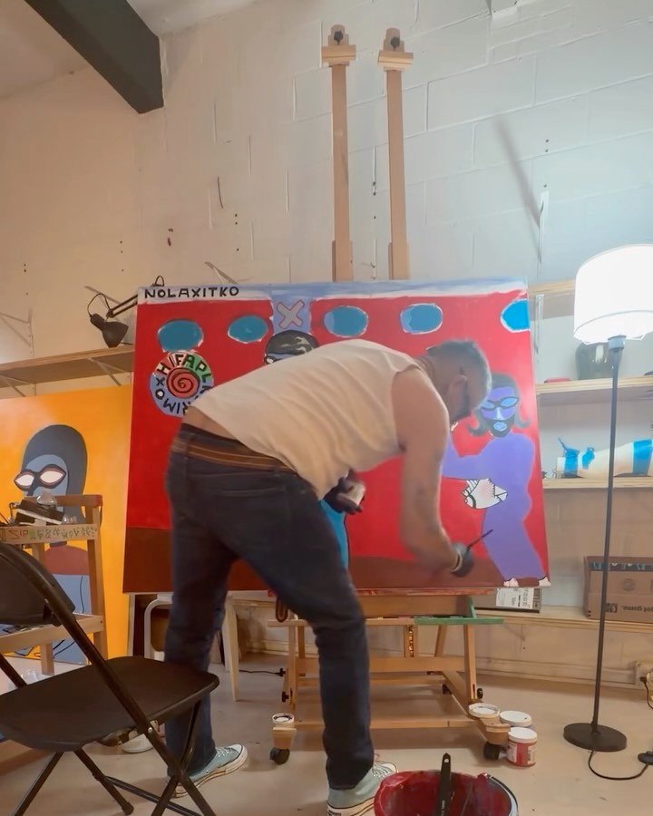Bazooka Joe, Gangster of Art, painting a large canvas at the easel