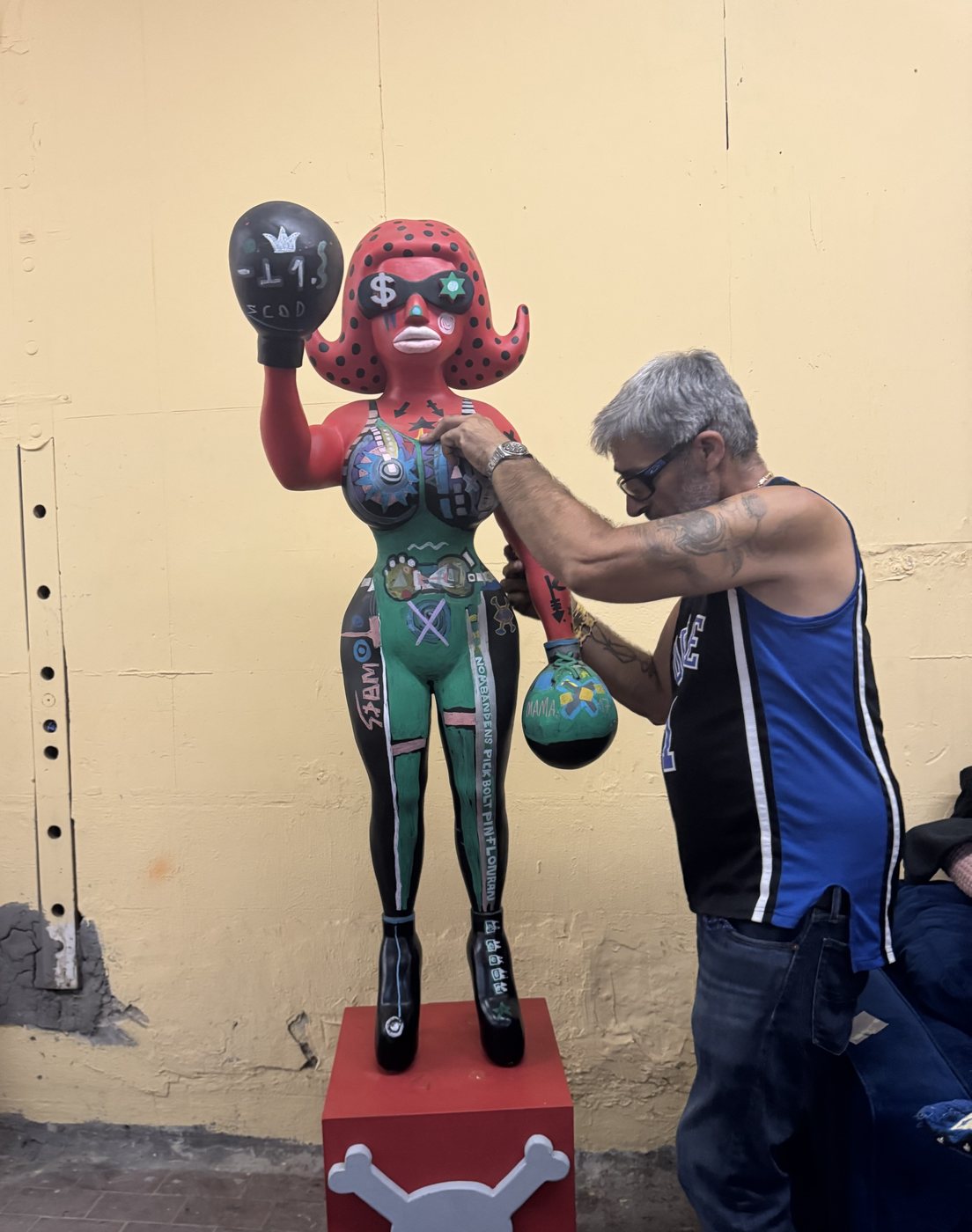 Bazooka Joe, Gangster of Art, finishing a painted sculpture of a boxer
